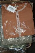 A large quantity of tunics and related items to include Modanisa Benin Elbise Tunik, Filizzade