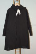 One omen's as new Uniqlo Hybrid Down Coat Black. Size M (White marks on front at bottom).