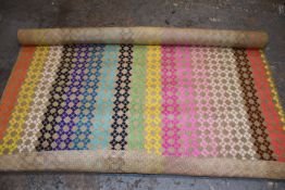 One handmade woven rainbow seagrass fibre rug.