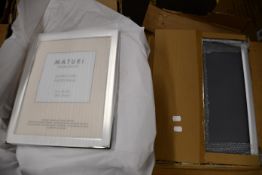 Eighteen boxed as new Maturi Home Decor silver plated photo frames (20 x 25cm), along with five