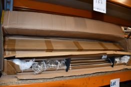 A quantity of boxed as new 105cm curtain poles (Approximately six pairs)