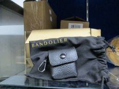 One Ricky Black Round Belt Bag, one Hailey Folio in black and gold, one AirPod Pro pouch in black