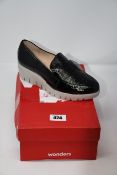 A pair of Wonders wedge shoes with flap (Size 36?).