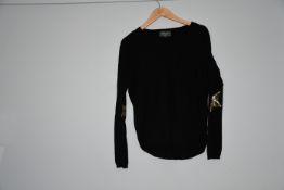 An as new Wyse of London black round neck jumper with gold sequin stars to sleeve (Size 1).