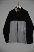 One as new Under Armour Stormproof Golf Rain Jacket Grey Size: XL (Model: 1342717-011).