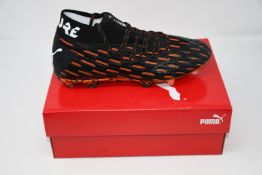 One boxed as new Puma Future 6.1 Netfit FG/GA. Black-white shocking orange. Size UK 7.5 (106179