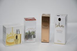 One Hermes Un Jardin Sur La Lagune eau de toilette (100ml), one J'adore Huile Divine Dry Silky