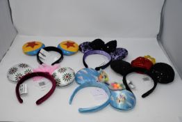 Five as new assorted Disney headbands.