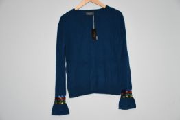 Two as new Wyse of London blue jumper with balloon sleeves and sequin cuffs (Size 1).