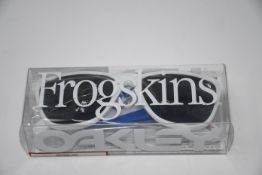 One boxed Oakley Frogskins 35th anniversary. Frame: polished white. Lens: prizm grey.