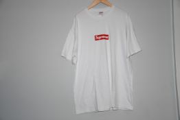 A pre-owned Supreme white t-shirt with Supreme motif to front (XL No Tags).