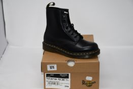 One pair of lady's boxed as new Dr. Martens 1460 8 eye boots in black (UK 4).