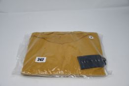 An as new Les Tien long sleeved Marigold mock neck top (S).