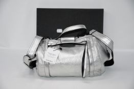 One Mark Jacobs silver bag.