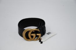 An as new Gucci brown leather belt with GG buckle (M).