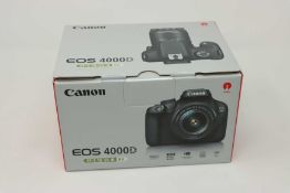 A boxed as new Canon EOS 4000D DSLR Camera and EF-S 18-55 mm f/3.5-5.6 III Lens.