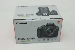 A boxed as new Canon EOS 4000D DSLR Camera and EF-S 18-55 mm f/3.5-5.6 III Lens.