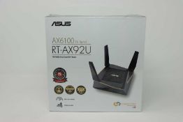 A boxed as new ASUS RT-AX92U AX6100 Tri-Band Gigabit Router (Box sealed).