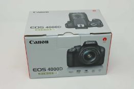A boxed as new Canon EOS 4000D DSLR Camera and EF-S 18-55 mm f/3.5-5.6 III Lens.