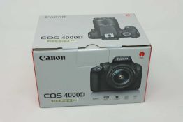 A boxed as new Canon EOS 4000D DSLR Camera and EF-S 18-55 mm f/3.5-5.6 III Lens.
