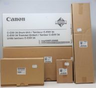 A boxed as new Canon C-EXV 34 Drum Unit and several boxed as new printer assembly parts; Paddle