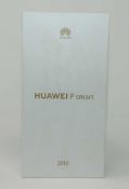An as new Huawei P smart 2019 POT-LX1 64GB in Midnight Black (Boxed with accessories, UK plug