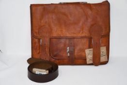 One as new Gusti Leder Briefcase. One as new Gusti Leder Kara belt. One as new Gusti Leder Leon tote