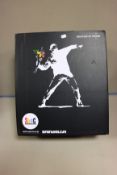 One boxed as new Medicom toy Banksy flower bomber brandalism sculpture.