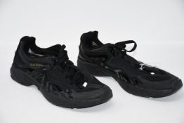 One pre-owned Acne Studios Buzz black sneakers (No box. Size unknown).
