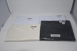 A quantity of as new LA Linen Poplin table cloths and runners in various styles (Approximately 10