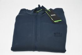 One man's as new Hugo Boss Skarley track top in dark blue (L).