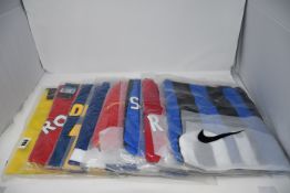 Eight as new assorted retro official Nike football tops (M).