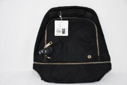 One as new Lululemon City Adventurer Backpack Mini (Colour: black/gold. Model: LW9CR9S).