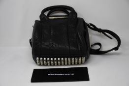 One as new Alexander Wang Rockie Black Pebbled Lamb handbag.