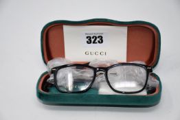 A pair of as new Gucci glasses frames with clear glass.