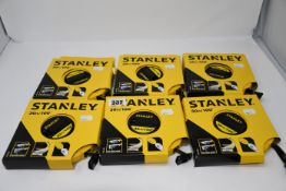 Six Stanley 30m tape measures.