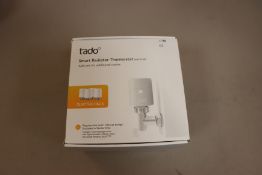 One boxed as new Tado smart radiator thermostat quattro pack.