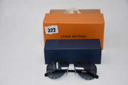 A pair of pre-owned Louis Vuitton sunglasses with case and box.