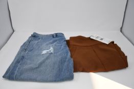A pair of as new Uterque trousers (M). A pair of as new Nine In The Morning jeans (Size TG28?).