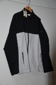 One as new Under Armour Stormproof Golf Rain Jacket Grey Size: XL (Model: 1342717-011).