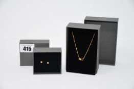 One as new Cos golden plated necklace with two cylinder pendants. One as new Cos golden plated