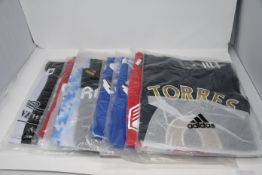 Eight as new assorted retro Adidas official football tops (M).