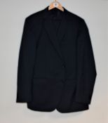 One pre-owned Emidio Tucci navy blue suit (size unknown).