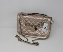 One pre-owned Guess Victoria Quilted Convertible Crossbody pink bag (VG710721. One scratch on the