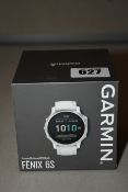 A boxed as new Garmin Fenix 6S premium multisport GPS watch (Silver with white band).
