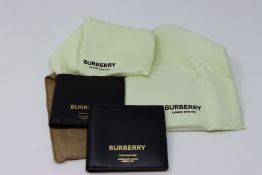 One as new Burberry Horseferry Print Leather International Bifold Wallet In Black (8014693). Two