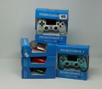 Five boxed as new Doubleshock wireless controllers for the PS4, PS4TV, & PS Now, various colours.
