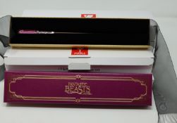 Five boxed as new The Noble Collection wands to include Albus Dumbledore, Leta Lestrange and