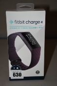 A boxed as new Fitbit charge 4 Advanced fitness tracking GPS watch (Rosewood classic band).