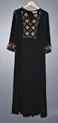 One pre-owned Tory Burch black tunic with strass decorations on the front. Size 8.